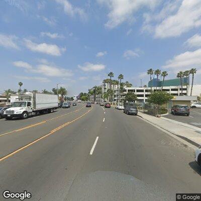 Pedestrian sitting on freeway divider causing traffic hazard, Los