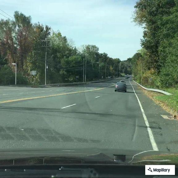 White pickup truck runs red light on Route 6, Farmington
