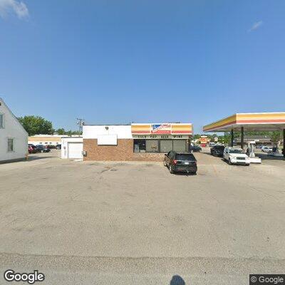 Male sustained leg laceration from falling car part at auto repair shop.