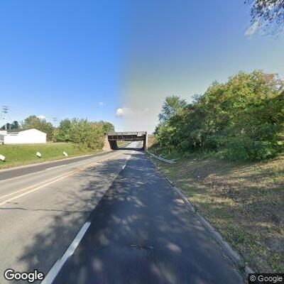 Green Toyota Corolla with unrestrained child headed northbound