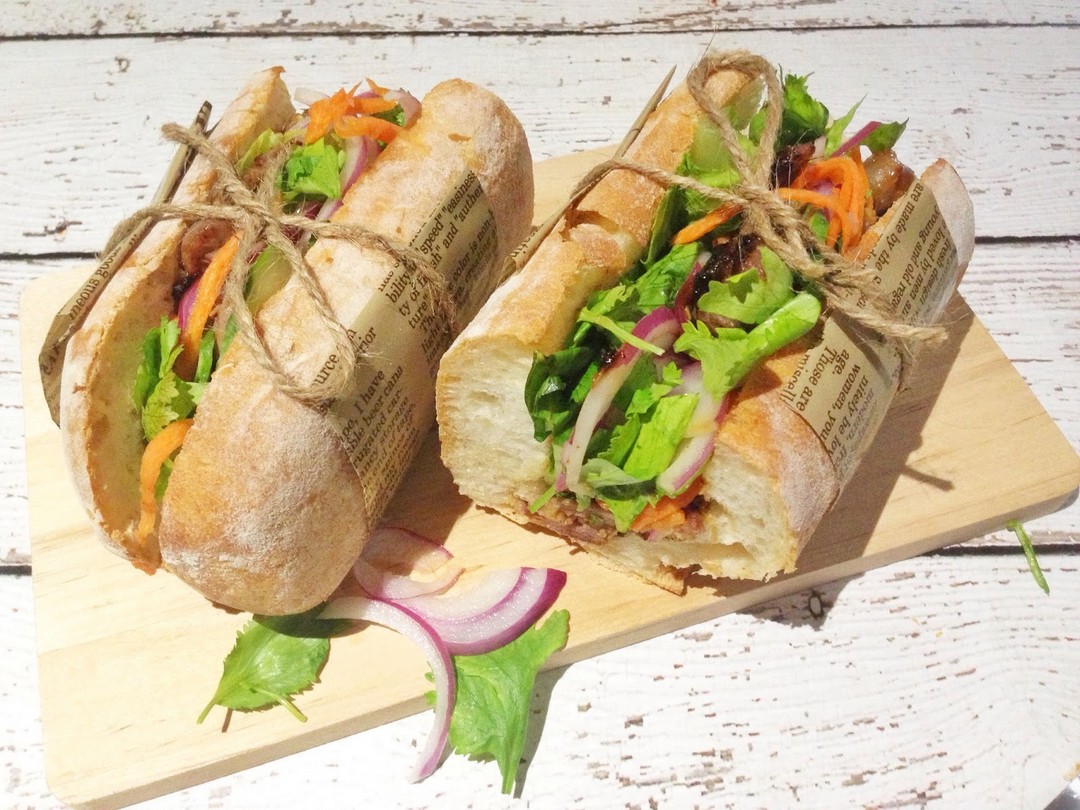 Bánh Mì Magic: Crunchy Bread, Juicy Pork, and Pickled Veggies Explosion! 