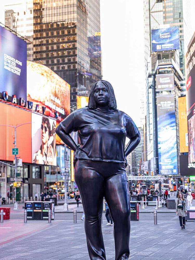Bronze Giants and Everyday Stories Meet in Times Square’s Electric Heart