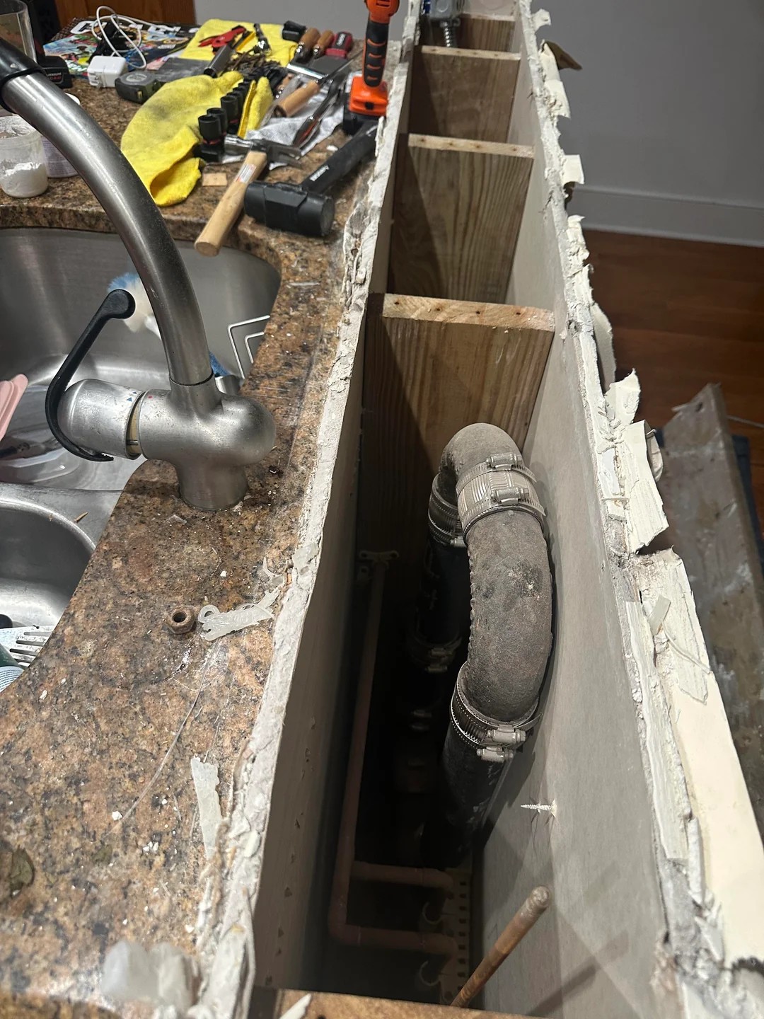What and why this type of cast iron pipe behind my sink?