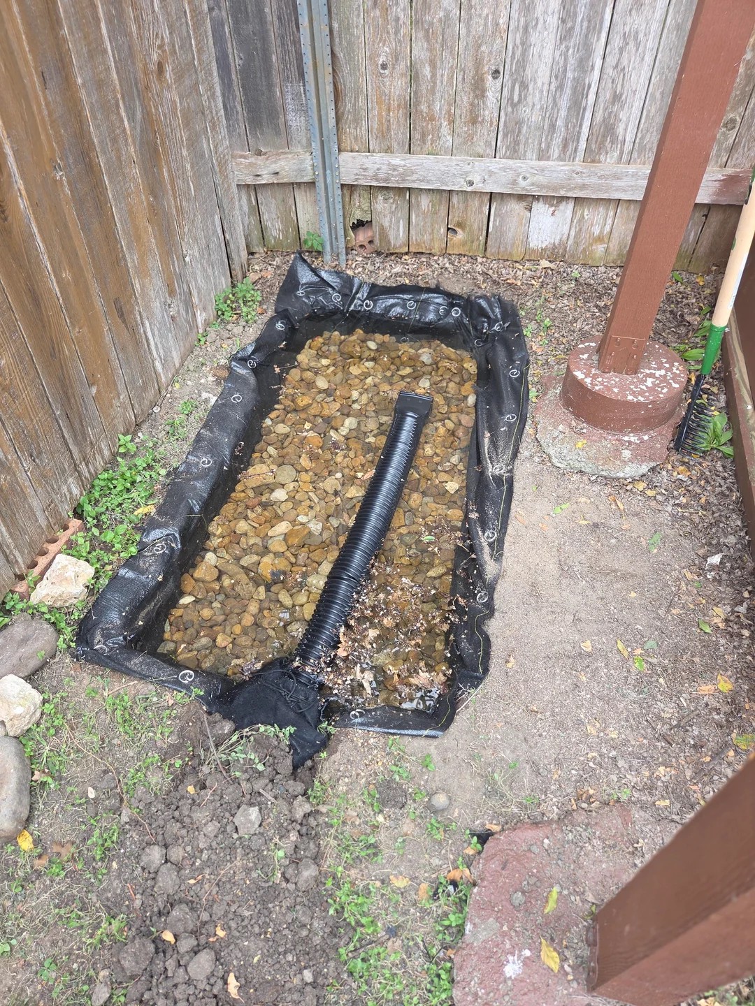 The rock drainage pit didn’t drain... and now I’ve got a mini pond. help!!!