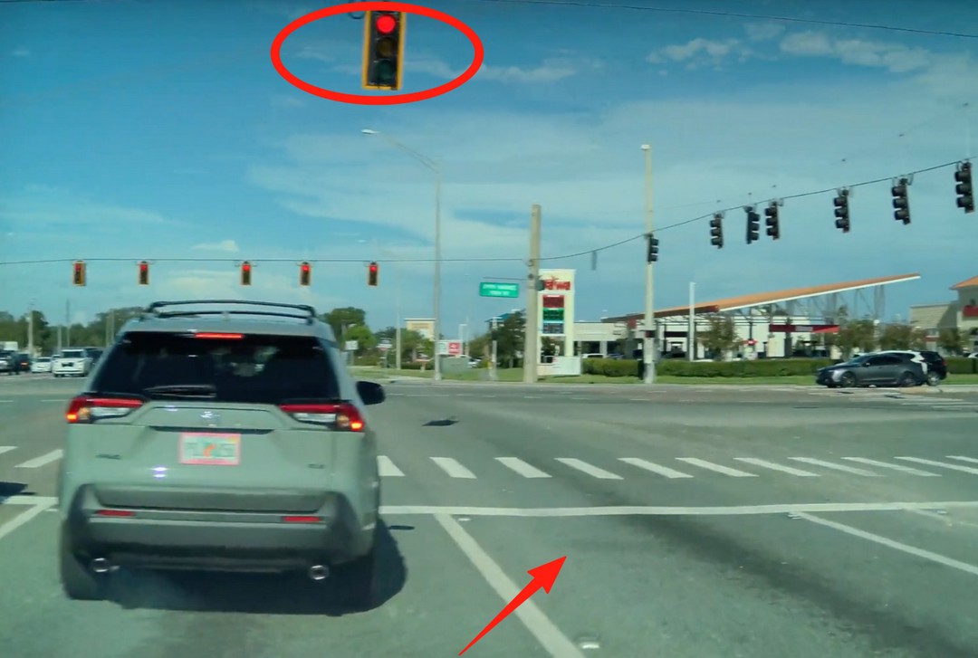 Took an open spot at a red light. Fair game or foul?