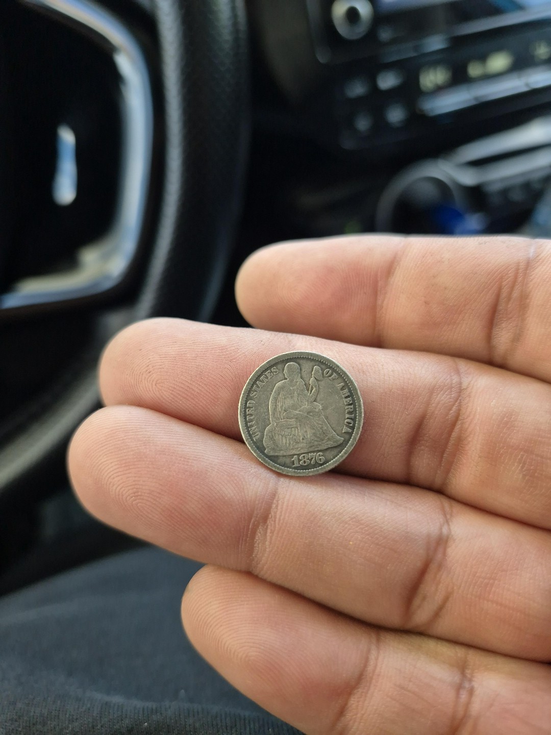 Got an old dime from the 19th century as change from a gas station