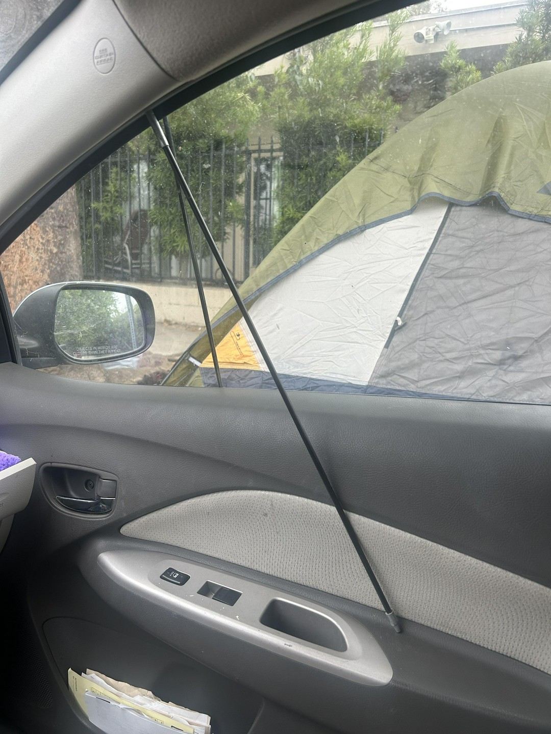 Woke up to A tent rod jammed in my car door. Is this a break in attempt or just weird?