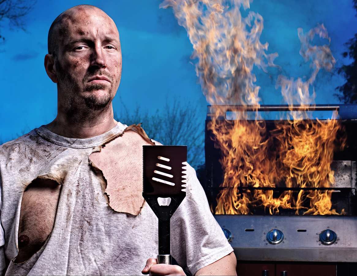 why men stand by the grill like it’s a campfire 