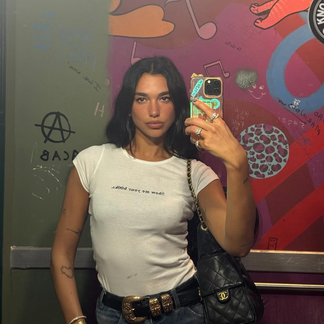 Dua Lipa’s Bookish Tee Sparks Fandom Debate 📚