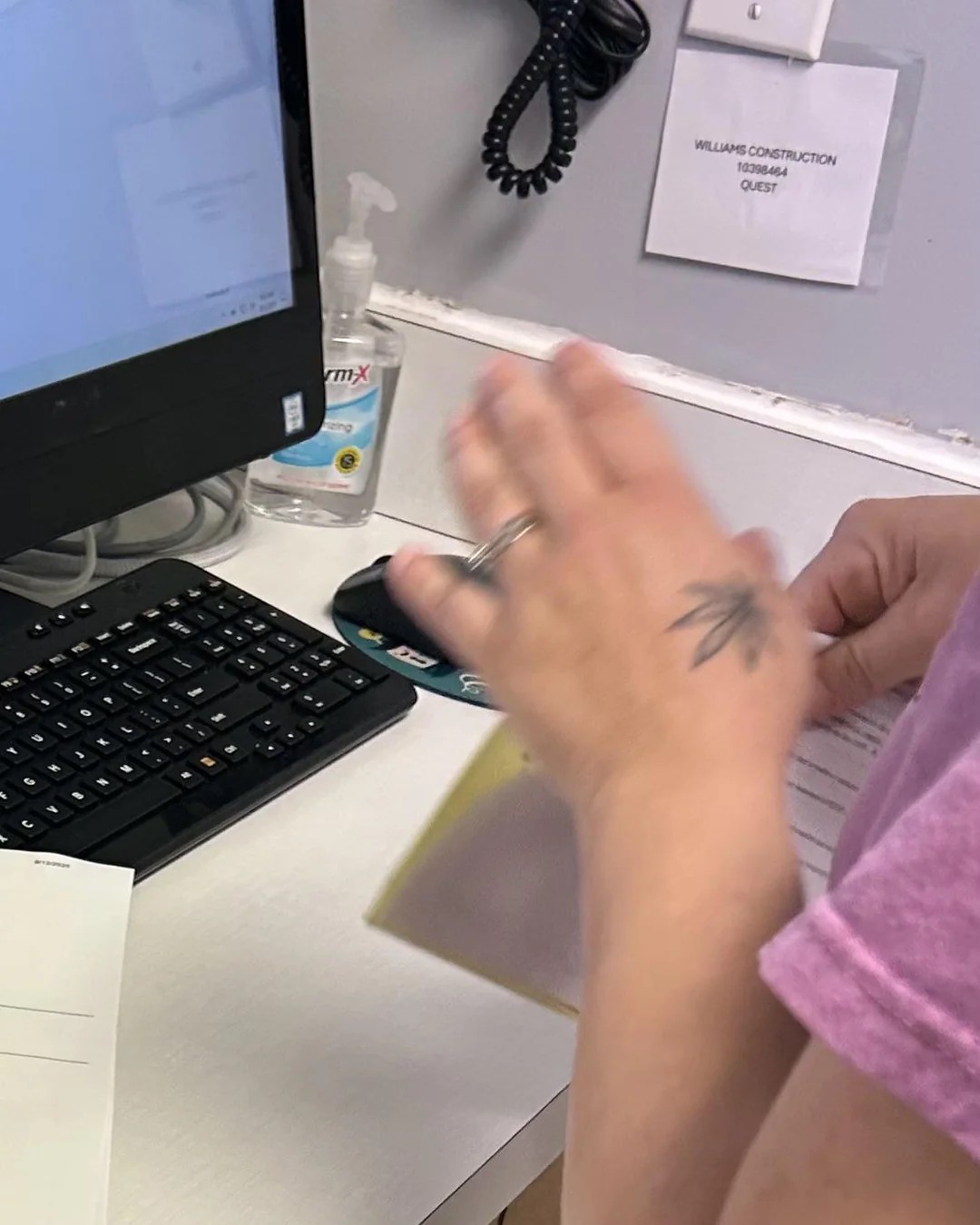 The worker administering his random drug test had a marijuana leaf tattoo on her hand