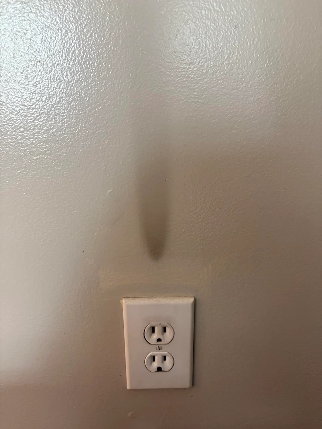 I Just Noticed This Black Mark Above an Outlet. Is This a Problem?