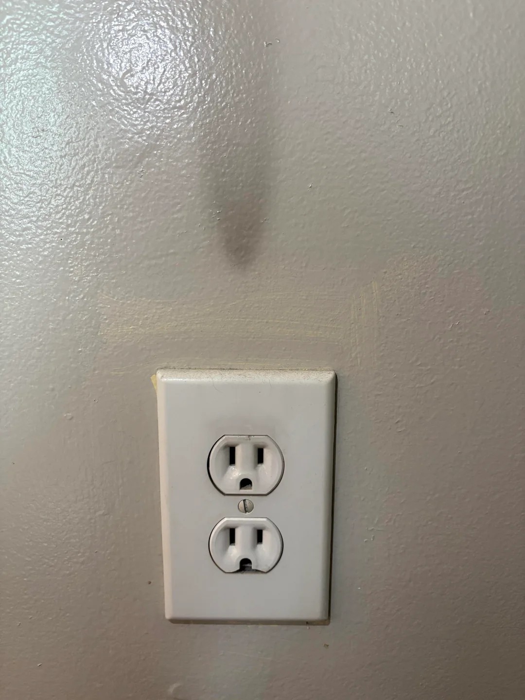 I Just Noticed This Black Mark Above an Outlet. Is This a Problem?