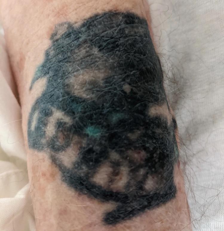 My grandpa passed away. Can anyone help me identify his tattoo?