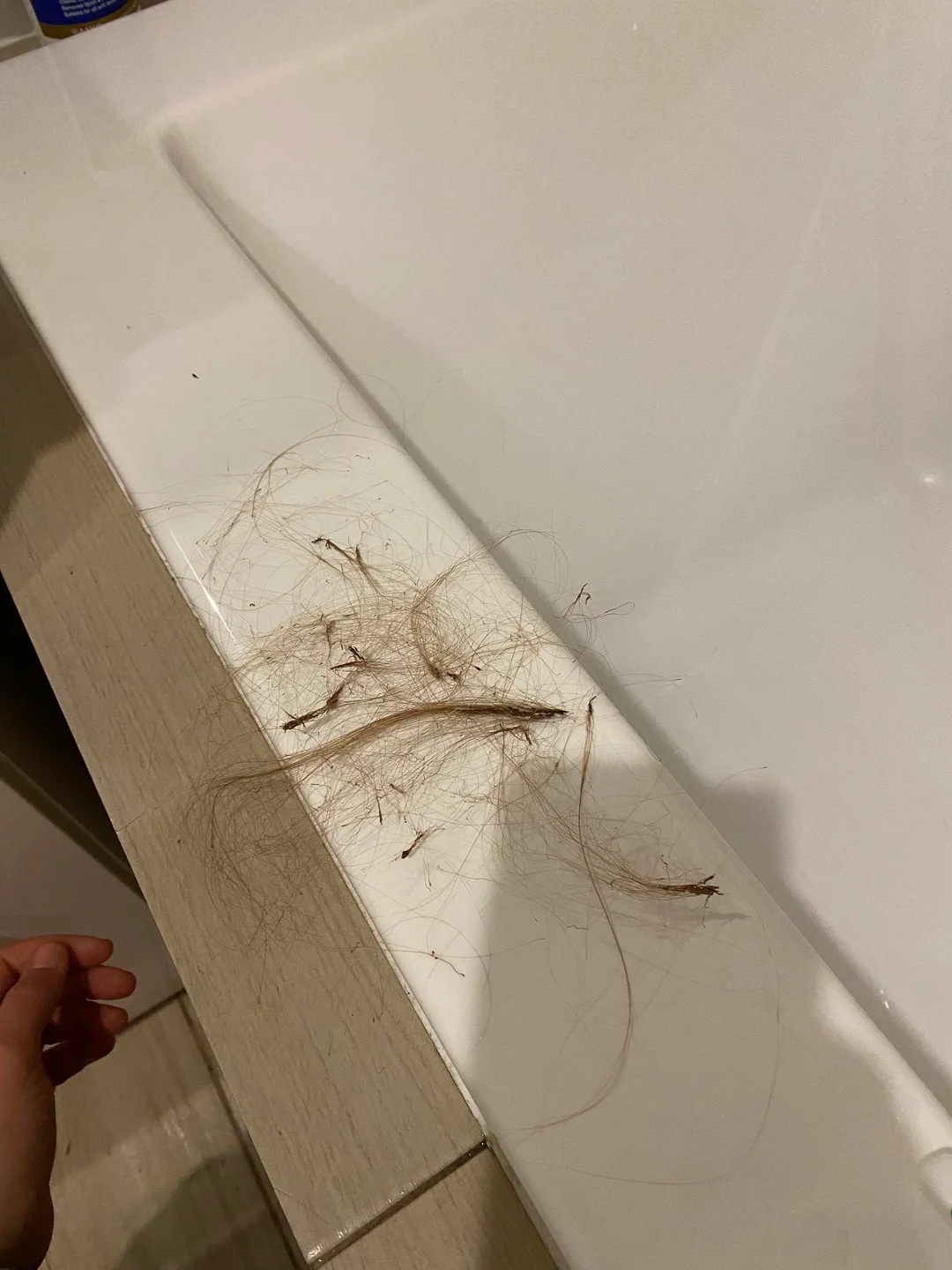 I'm Pulling Out Chunks of Hair With a Strange Waxy Substance on the Roots. What Is This?!