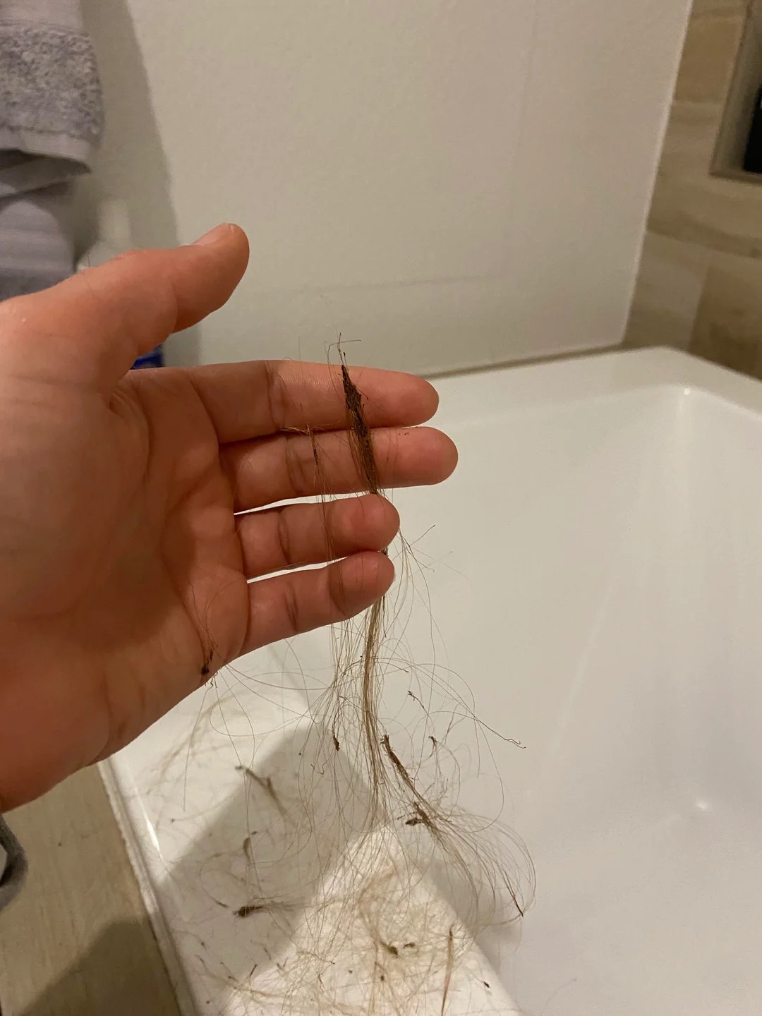 I'm Pulling Out Chunks of Hair With a Strange Waxy Substance on the Roots. What Is This?!