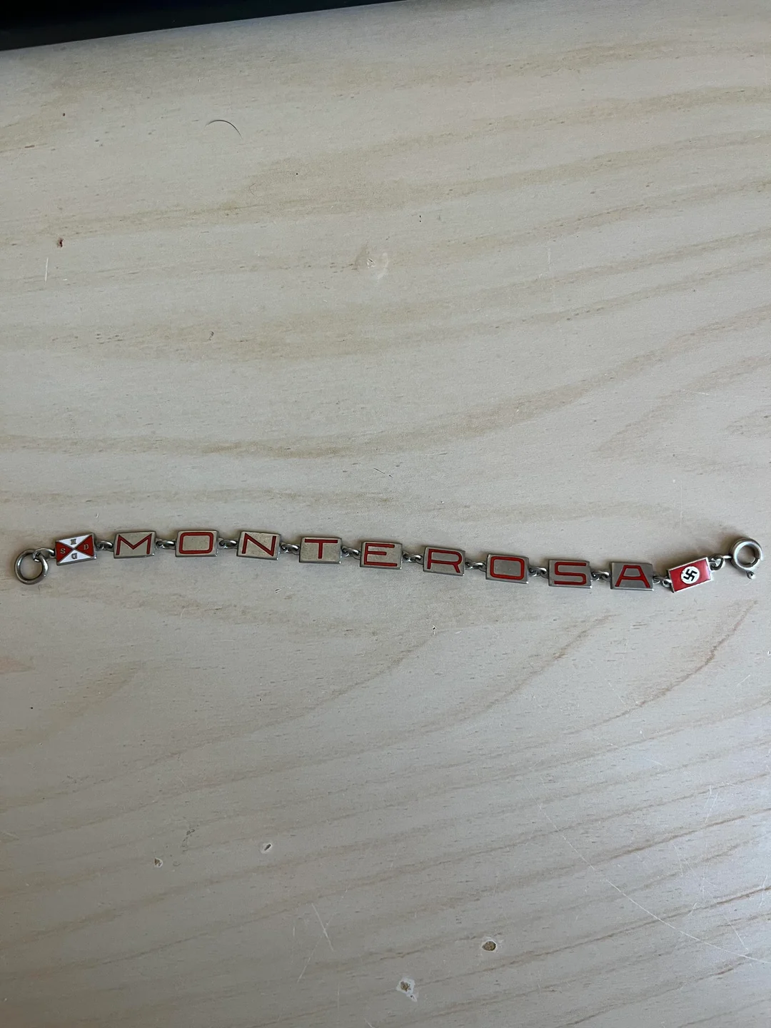 My late grandma worked at a British munitions factory. So why did she have this bracelet with a symbol like THIS???