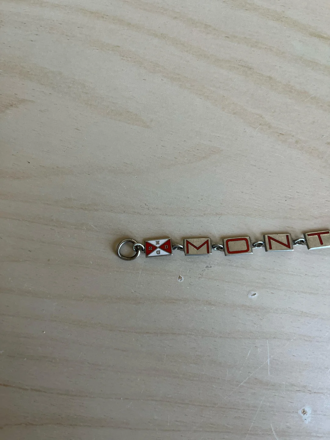 My late grandma worked at a British munitions factory. So why did she have this bracelet with a symbol like THIS???