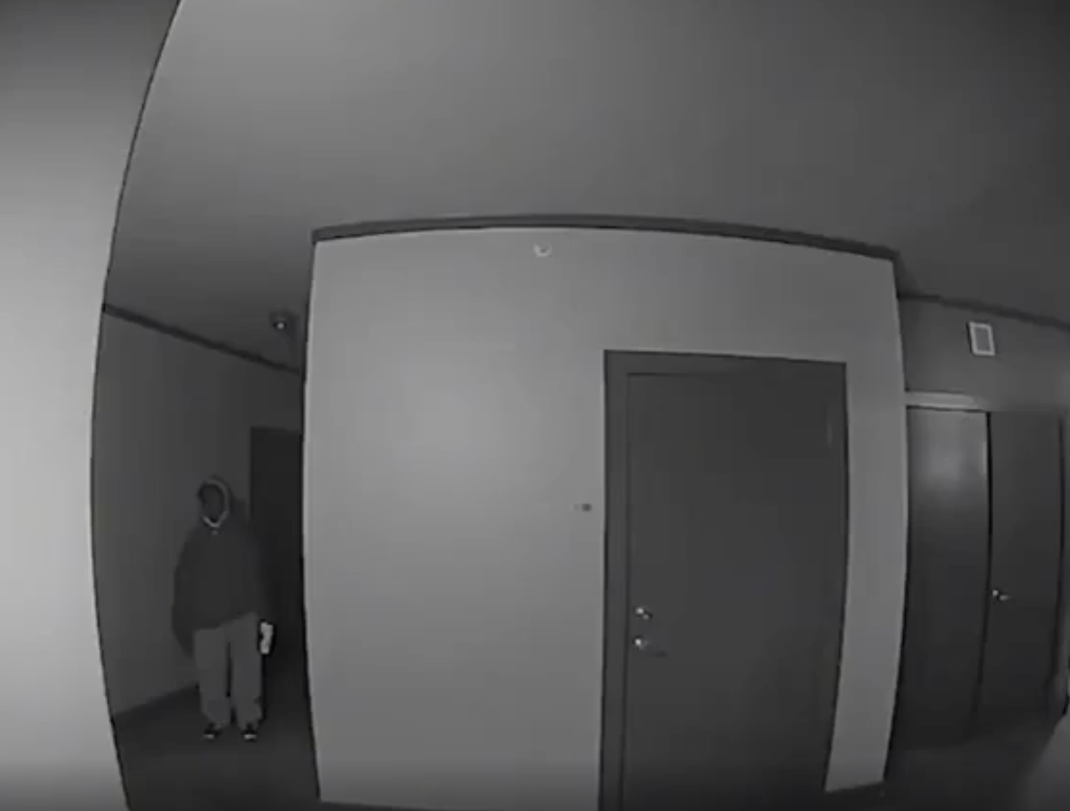 Creepy guy is caught on ring camera standing outside woman's apartment every night for nearly a month.