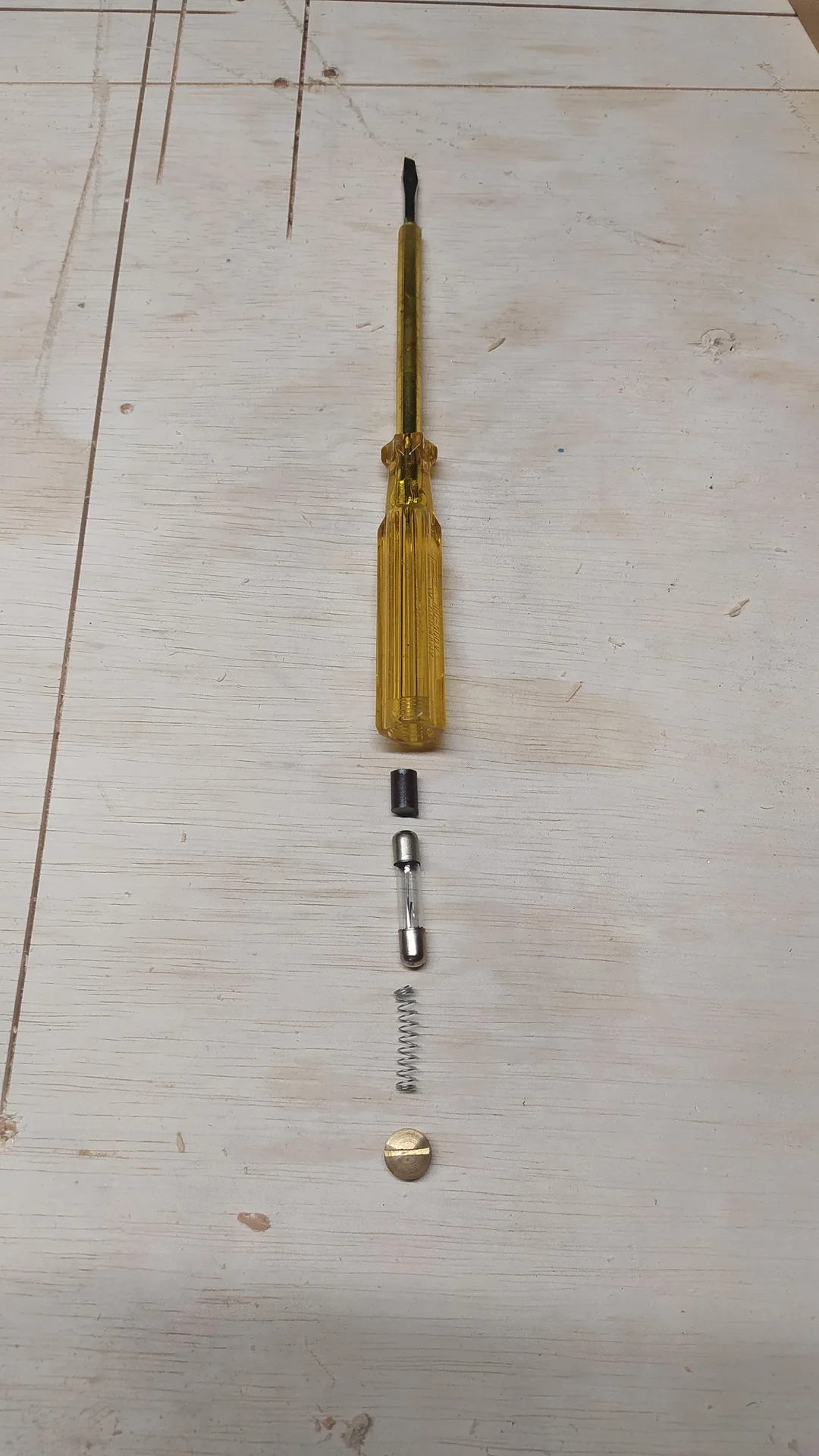 I found my dad’s weird Screwdriver. What Is This Metal Stick Inside It?