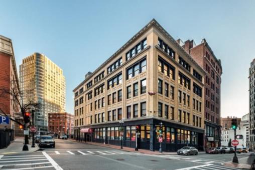 Boston office building sells for less than half